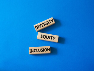 Diversity Equity Inclusion symbol. Concept words Diversity Equity Inclusion on wooden blocks. Beautiful blue background. Business and Diversity Equity Inclusion concept. Copy space