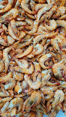Chilled boiled shrimp in a supermarket or grocery store, close-up. Seafood