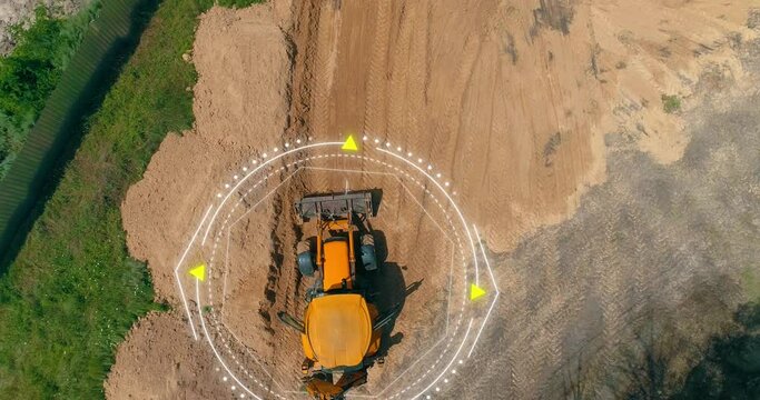 The grader works at the construction site. The concept of a smart grader. A smart construction site. Visualization of smart construction