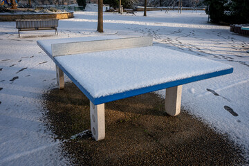 Gennevilliers, France - 12 18 2024: Eco-neighborhood. View of Ping pong table under the snow in a...