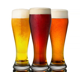 Four glasses with different beers on a white background. The file contains a path to cut.