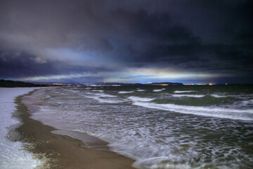 Baltic Sea beach during a storm at night. Gdansk, Poland