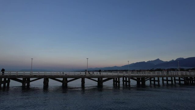 Aerial video footage of the Marina di Massa pier in Tuscany Italy 