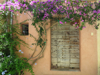 An ancient weathered stylish old wooden door