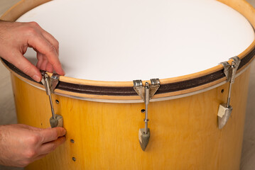 close-up of repairing and adjusting the tension of a kick bass drum