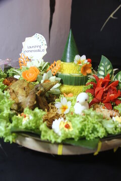 Tumpeng rice is a traditional food that is usually made when there is a special event, this rice is shaped like a cone and decorated as beautifully as possible