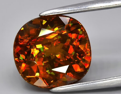 natural yellow sphene titanite gem on the background