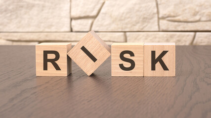 word RISK block wood on wooden table background