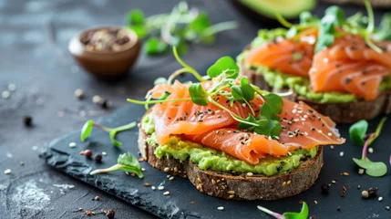 Foto op Canvas Open sandwiches with salted salmon, guacamole avocado and microgreens. Healthy food © Julia Jones