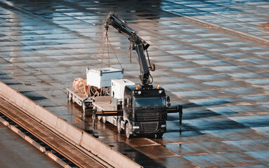 Power Supply Generator Loading On The Cargo Truck By The Remote Crane Manipulator