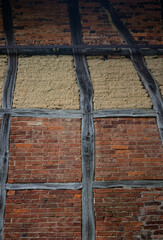  old timber framing  brick wall
