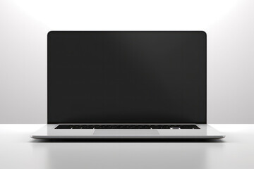 Sleek laptop with a clean and blank screen against a gray backdrop