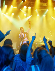 Man, singing and band or crowd at live concert performance for rock party, music festival or audience. Male people, instruments and hand up or entertainment artist show or listening, weekend or event