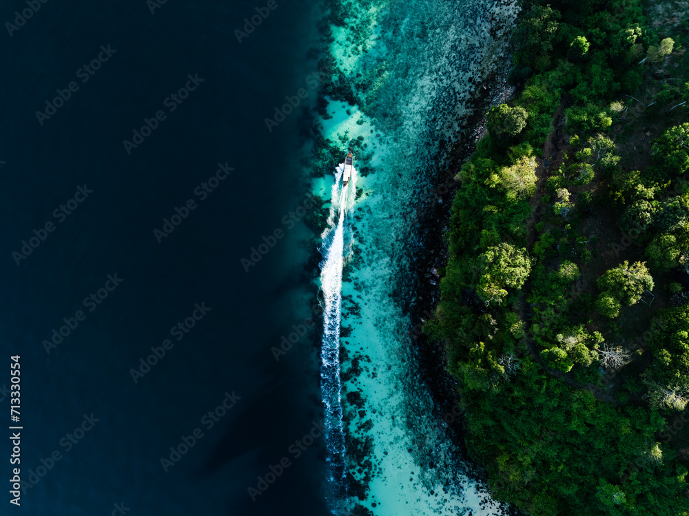 Wall mural view from above, stunning aerial view of a longtail boat sailing on a turquoise water. phuket, thail - Wall murals