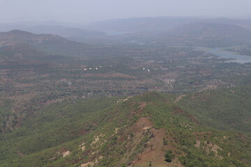 Fototapeta na wymiar Hills surrounding Sinhagad Fort Exploring the Surroundings of Sinhagad Fort in Pune