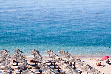 Sunbeds with umbrellas on the beach for publication, design, poster, calendar, post, screensaver,...