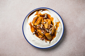 Labneh yogurt cream cheese with roasted apples, copy space. Traditional arabian or middle eastern homemade labneh dip. Greek yogurt.
