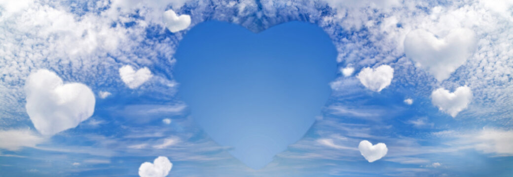 Fluffy clouds forming a hearts shape on blue sky background, soft focus. Heavenly clouds. Holidays of love, Valentine, Mother day, romantic. Copy space. Empty place.