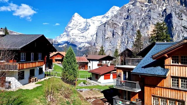 Switzerland Murren 4K Video Traditional Car-Free Alpine Village with Dark Wooden Chalets and Snow Peaks of Alps Mountains Scenic Bernese Oberland Landscape Swiss Travel Destination