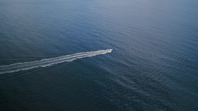 Drone shot of a motorboat in the Atlantic Ocean, Halifax, Canada. Nova Scotia