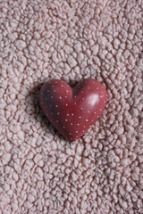 heart on a pink plush background.