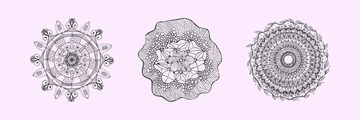 Collection of hand drawn mandala elements.  Boho style. Set of mandalas on a purple background
