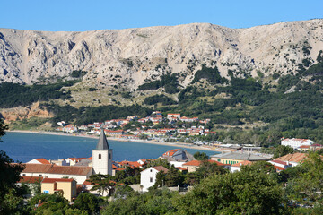 View of the Church of the Holy Trinity and Baska village and beach on the Island of Krk, Croatia