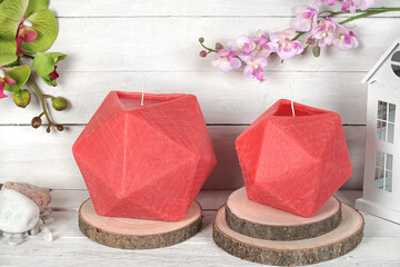 Colorful candle of various shapes on wooden background. Scented candle. Candle with glass. Eggs, sea, heart, flower, fish, starfish, shell, coral, angel. Gift for Christmas, Easter, Valentine's Day.