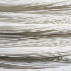 Close-up of textured white woven fabric with irregular raised patterns