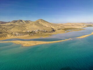 The drone aerial view of Sotavento beach, Costa Calma, Fuerteventura Island, Spain. Sotavento is...