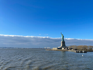 New York, New York – January 11, 2024: the view of the Statue of Liberty from the ferry boat with tourists