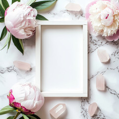 Flat Lay arrangement with rustic white picture frame, and Peony flowers on a marble backdrop