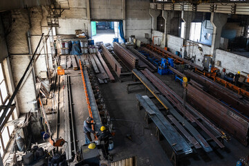 Kyiv, Ukraine - 15.06.2022: Various metal structures cut in the workshop. The factory produces metal parts, elements, and structures. Plant for the production of metal structures. - 713387128