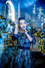 Attractive girl going to ball, at night. Fashion model