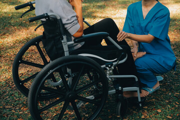 young asian physical therapist working with senior woman on walking with a walker