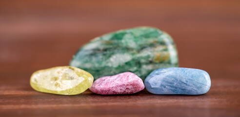 Colorful healing crystal stones, gemstones. Alternative therapy, chakra energy or spiritual banner. Positivity.