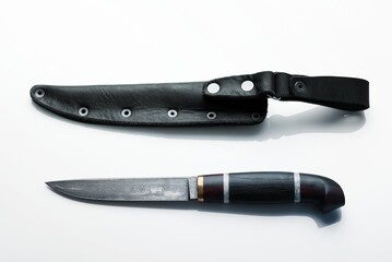 Handmade beautiful hunting knife with a sharp gray blade