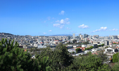 Fototapeta na wymiar San Francisco: Looking Northwest from Potrero Hill over the city including the Mission area. The tops of the Golden Gate Bridge can be seen in the far distance.