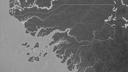 Guinea-Bissau outlined. Grayscale elevation map