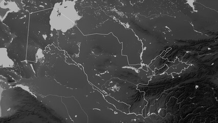 Uzbekistan outlined. Grayscale elevation map © zelwanka