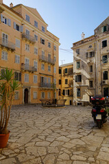 Romantic backstreet, side street or alleys in historic old town of Corfu Island, Greece with...