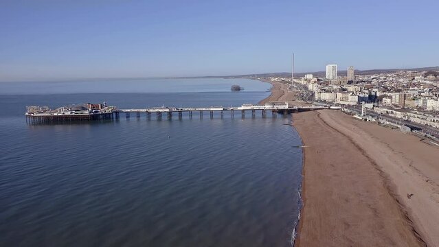Aerial footage of the Victorian Palace Pier in Brighton, a popular attraction at this popular resort City in East Sussex, England.