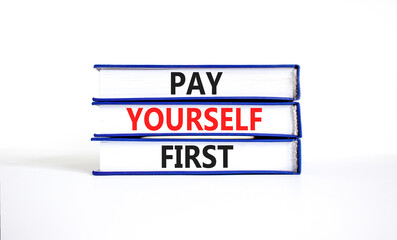 Pay yourself first symbol. Concept words Pay yourself first on beautiful books. Beautiful white table white background. Business and pay yourself first concept. Copy space.