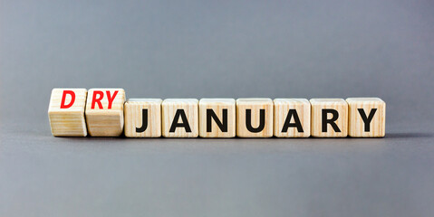 Dry January challenge symbol. Concept words Dry January on beautiful wooden cubes. Beautiful grey...