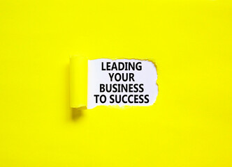 Leading your business to success symbol. Concept words Leading your business to success on beautiful white paper. Beautiful yellow paper background. Leading your business to success concept Copy space