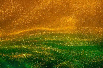 Magic Galaxy of golden dust particles in duotone fluid. Various stains and overflows of glistering...