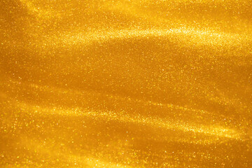 Glittering flows of gold particles in fluid. Various stains and overflows of golden dust particles...