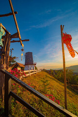 The Northern Coffee Shop is situated atop a hill, with a sunset background, and is decorated with Northern flags.