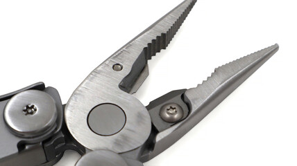 One modern gray iron open folding multifunctional knife on a white background. Multi-tool with advanced tools. Pliers close up. Compact and portable product. Pocket knife. EDC concept. Copy space.