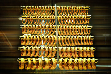 Gold bracelets in the jewelry store window.